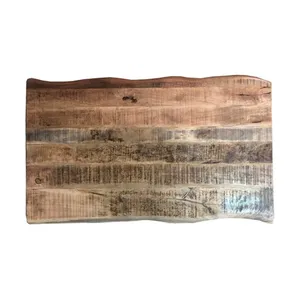 Bild von Baumkanten Tisch aus Mangobaum Massivholz und Eisen im Loft Design